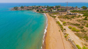 Pink sand and turquoise water at Crane Beach, one of the best beaches in Barbados viewed from the cliffs.