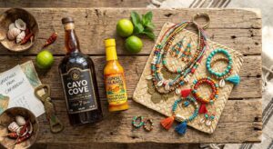 A collection of authentic Barbados souvenirs including rum and hot sauce.